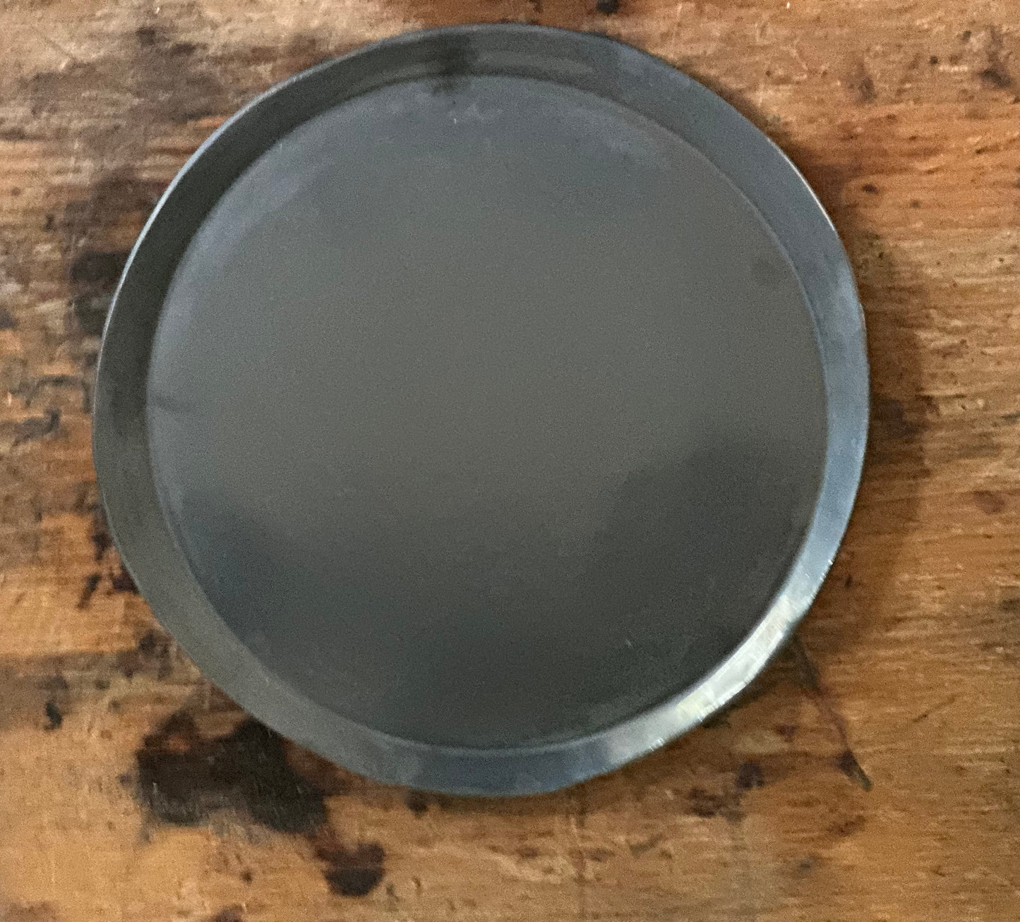 Large handmade pottery serving platter in a black metalic glaze